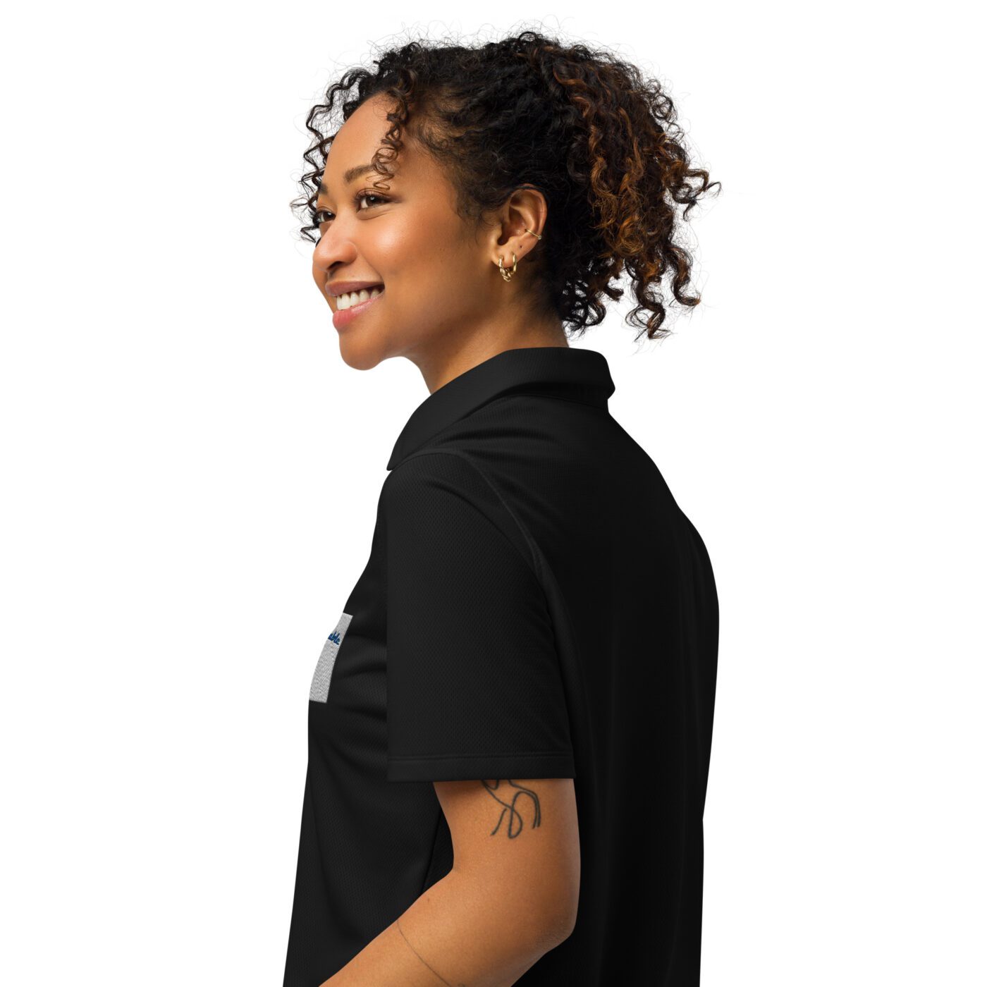 A woman with curly hair wearing black shirt.