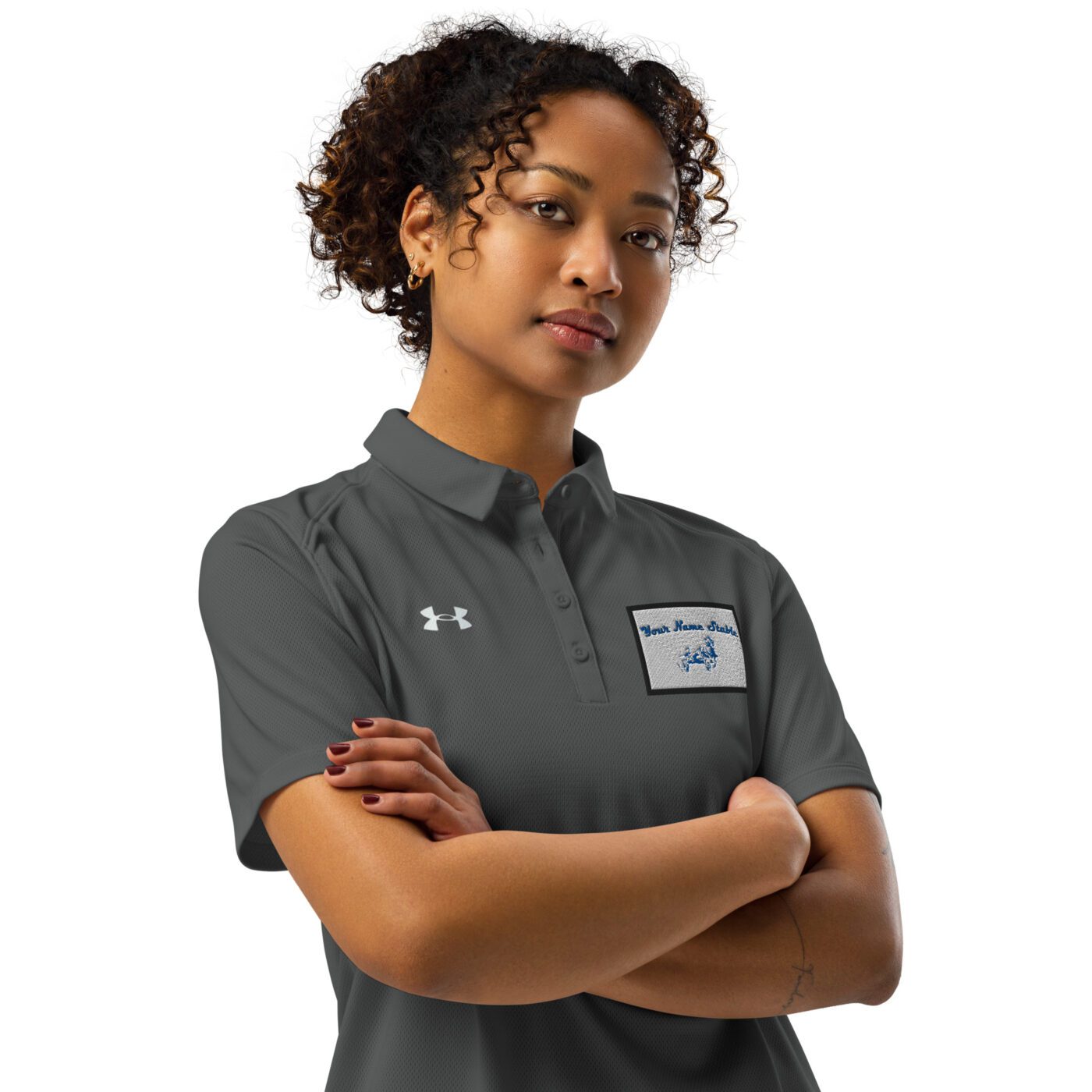 A woman standing with her arms crossed.