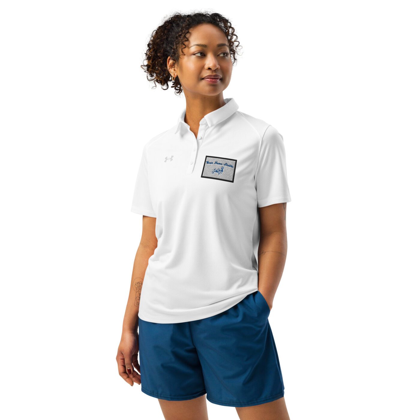 A woman wearing blue shorts and white shirt.